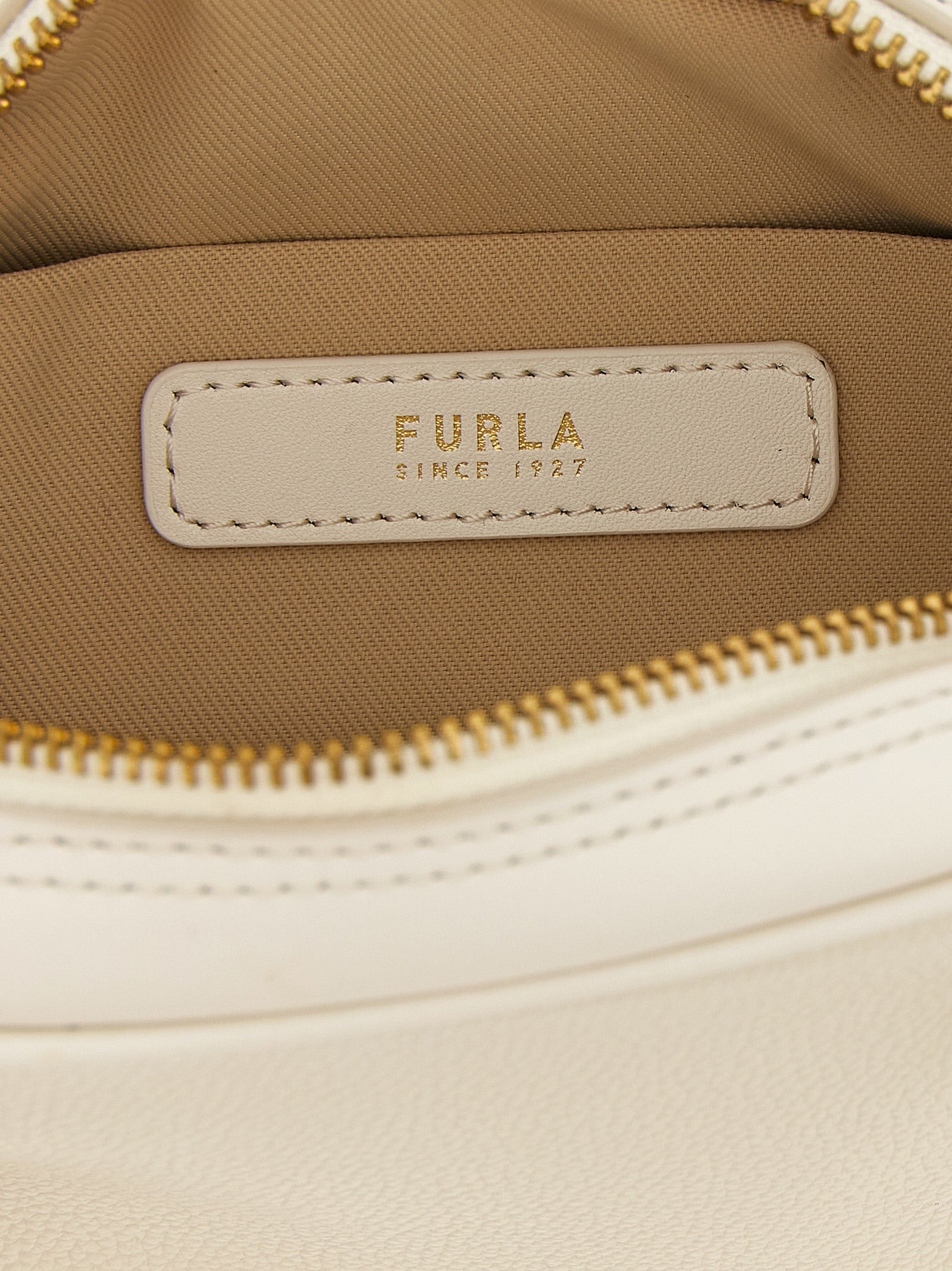 Dome Handbag by Furla for women in calfskin leather cream, gold & white features a ornamental silhouette, showcasing a secure zipper, ample , and ornamental shoulder-strap, adjustable-strap & handle for a sophisticated look.