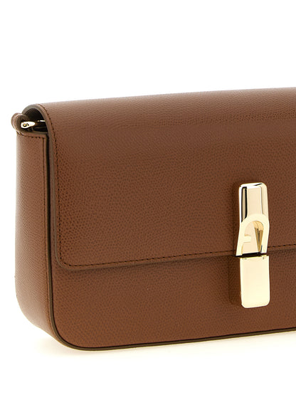 Crossbody Pouch Handbag by Furla for women in bos taurus calfskin leather brown & gold features an versatile silhouette, showcasing a secure flap and versatile with versatile crossbody-strap & adjustable-strap for a versatile finish.