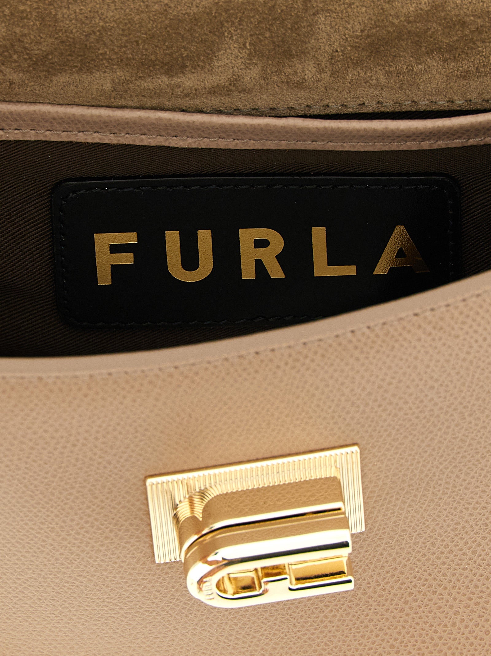 Mini Crossbody Handbag by Furla for women in calfskin leather beige features a transformative sophistication silhouette, showcasing a secure turn-lock, ample , and versatile crossbody-strap for a transformative sophistication look.