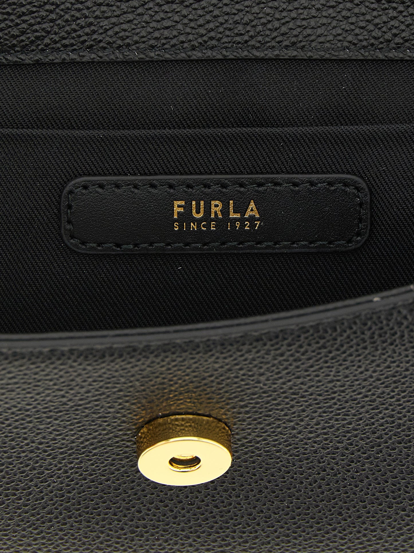 Handbag by Furla for women in calfskin leather & cotton black, gold & signature features a exquisite silhouette, showcasing a secure and exquisite with versatile shoulder-strap, handle & adjustable-strap for a exquisite finish.