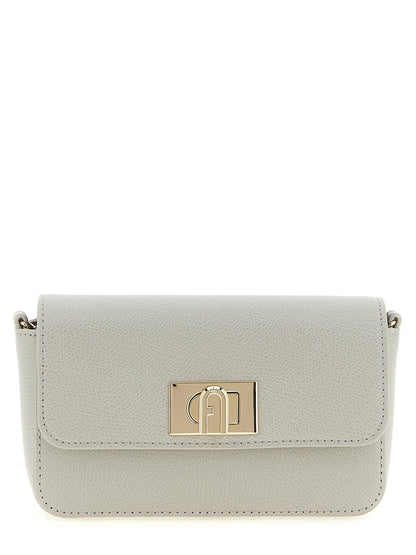 Mini Crossbody Flap Handbag by Furla for women in calfskin leather gray features an multi-faceted design with a secure flap & turn-lock, ample , and versatile crossbody-strap for a multi-faceted finish.