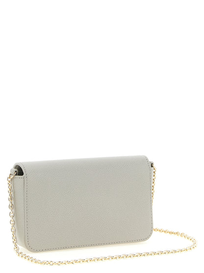 Mini Crossbody Flap Handbag by Furla for women in calfskin leather gray features a versatile chic silhouette, meticulously detailed with a secure flap & turn-lock, ample , and versatile crossbody-strap.