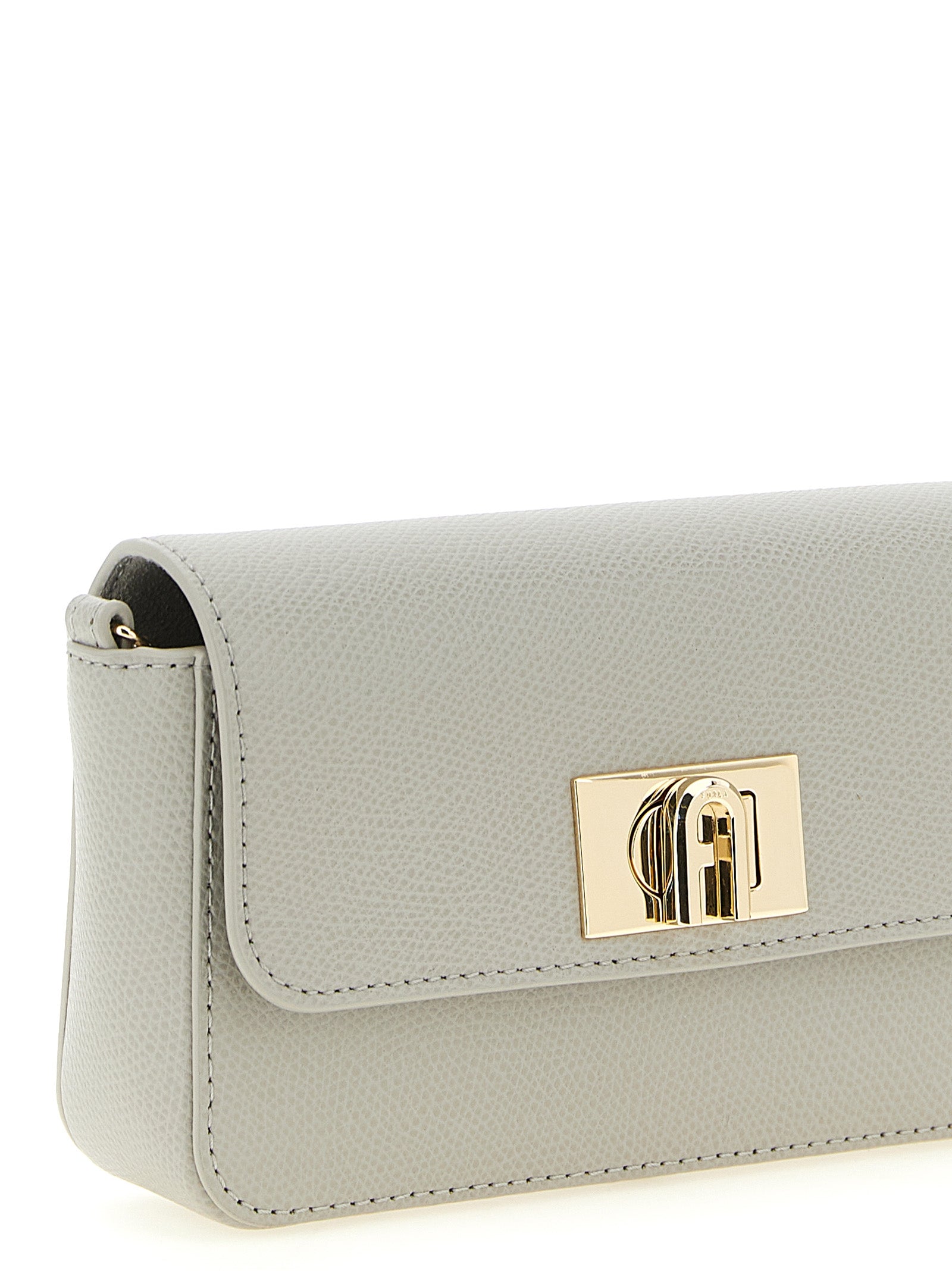 Mini Crossbody Flap Handbag by Furla for women in calfskin leather gray features a transformative sophistication silhouette, showcasing a secure flap & turn-lock, ample , and versatile crossbody-strap for a transformative sophistication look.