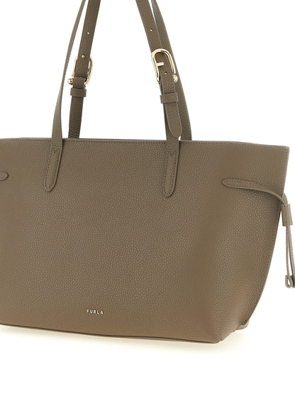 Tote Bag by Furla for women in bos taurus calfskin leather gray, gold & signature features a jet-set sophisticated Ava Bos Taurus Calfskin Leather Tote Bag design with a secure buckle, ample , and versatile adjustable-strap & handle for a jet-set sophisticated finish.