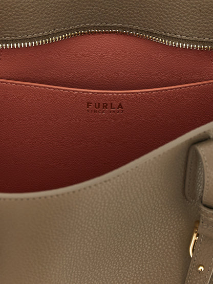Tote Bag by Furla for women in bos taurus calfskin leather gray, gold & signature features a jet-set Ava Bos Taurus Calfskin Leather Tote Bag design, complete with a secure buckle, ample , and versatile adjustable-strap & handle for a jet-set look.