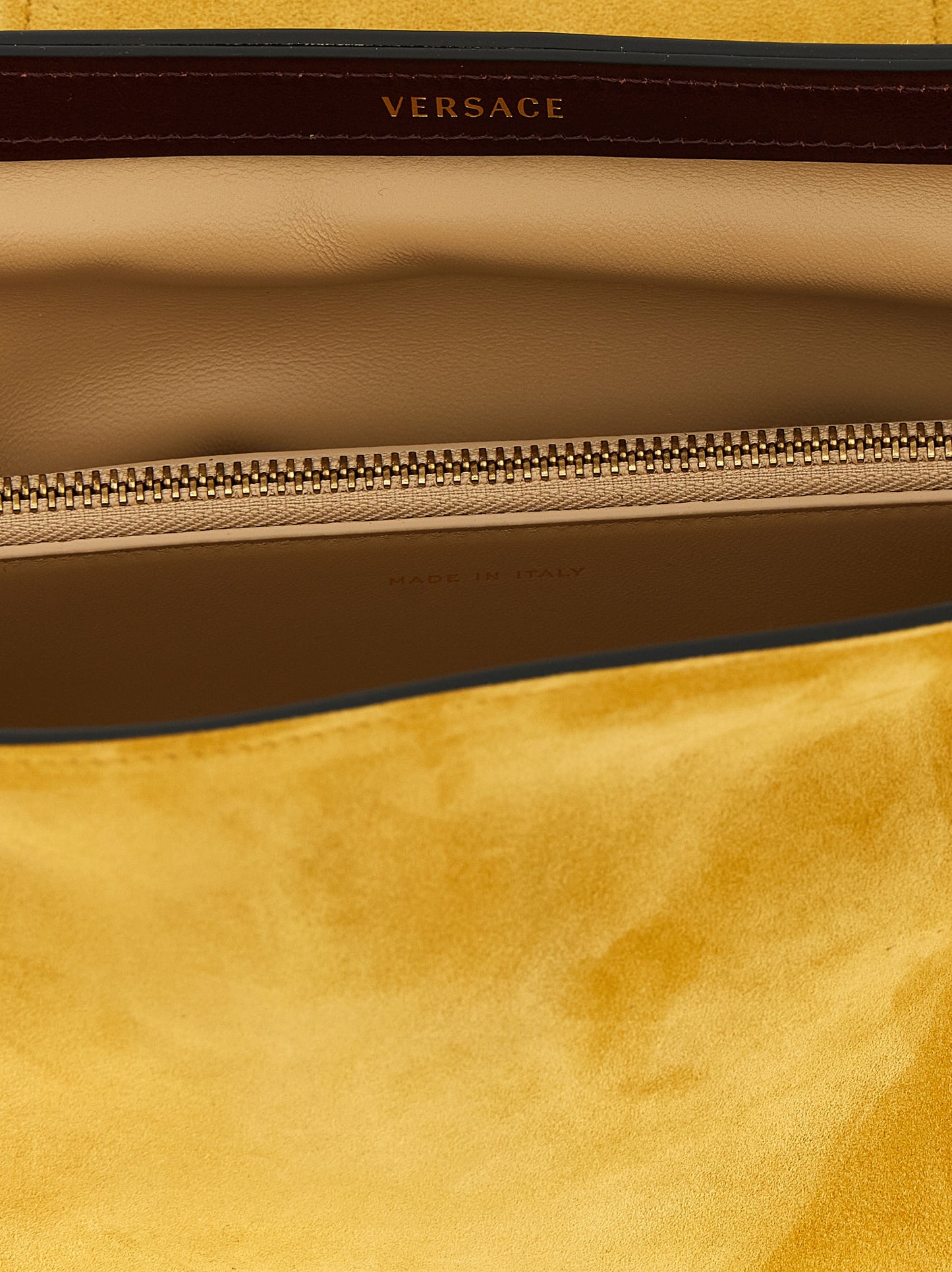 Clutch Handbag by Versace for women in bos taurus calf suede leather bicolour, yellow & signature showcases a sculptural silhouette, featuring a secure zipper, ample built-in-compartments, and versatile for a sculptural finish.