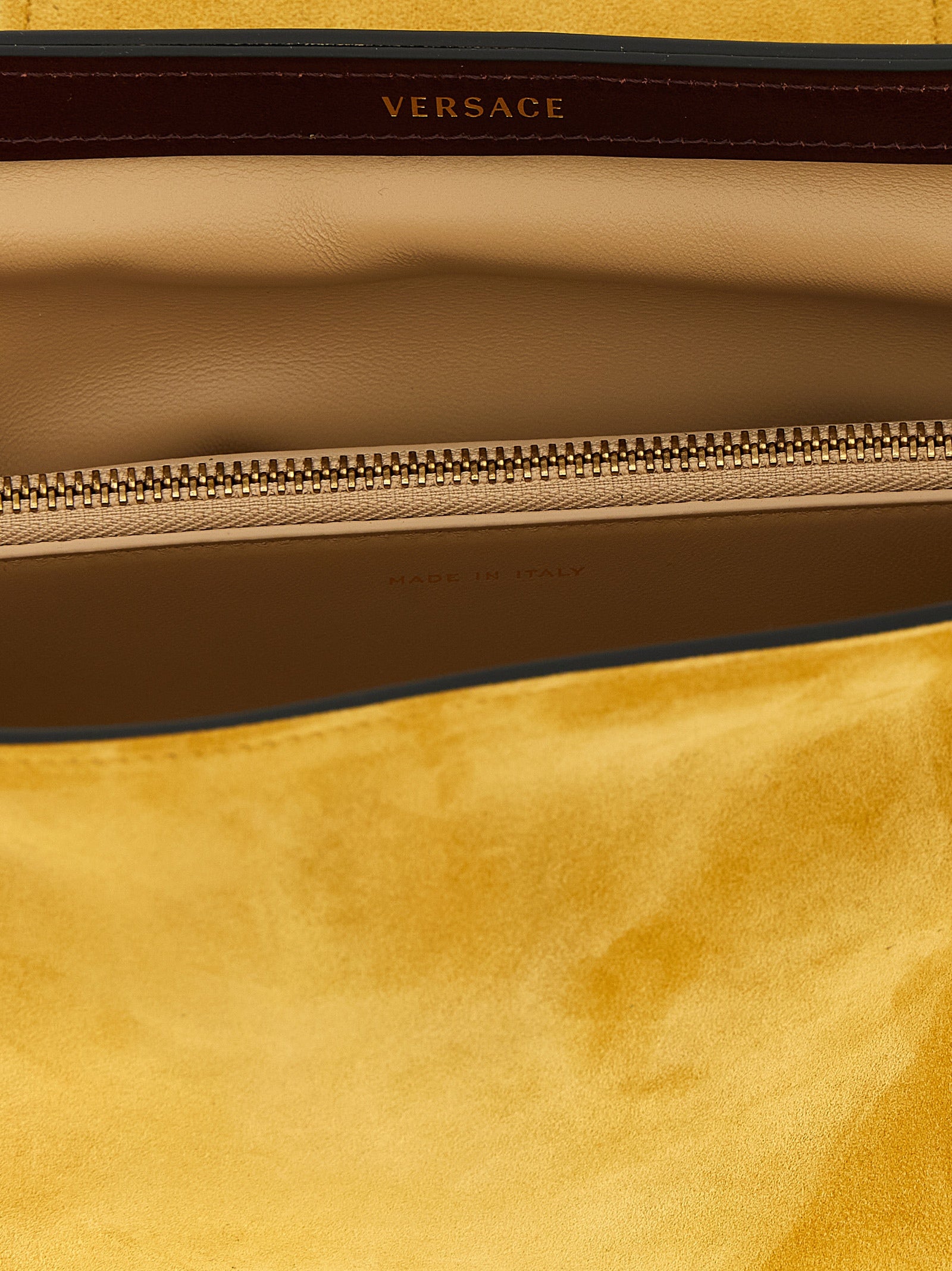 Clutch Handbag by Versace for women in bos taurus calf suede leather bicolour, yellow & signature showcases a sculptural silhouette, featuring a secure zipper, ample built-in-compartments, and versatile for a sculptural finish.