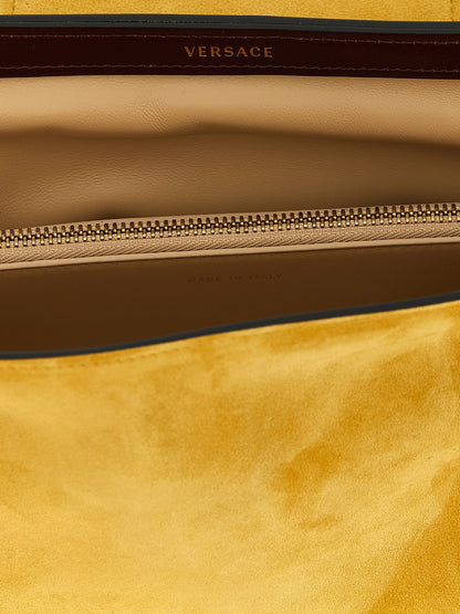 Clutch Handbag by Versace for women in bos taurus calf suede leather bicolour, yellow & signature showcases a sculptural silhouette, featuring a secure zipper, ample built-in-compartments, and versatile for a sculptural finish.