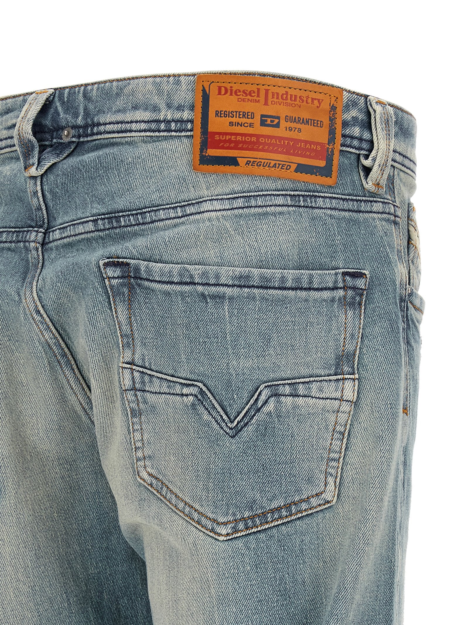 Jeans by Diesel for men in stretch denim cotton light-blue & signature presents a refined pantology silhouette, artfully defined by a refined pantology straight-leg, long, and a sophisticated low rise.