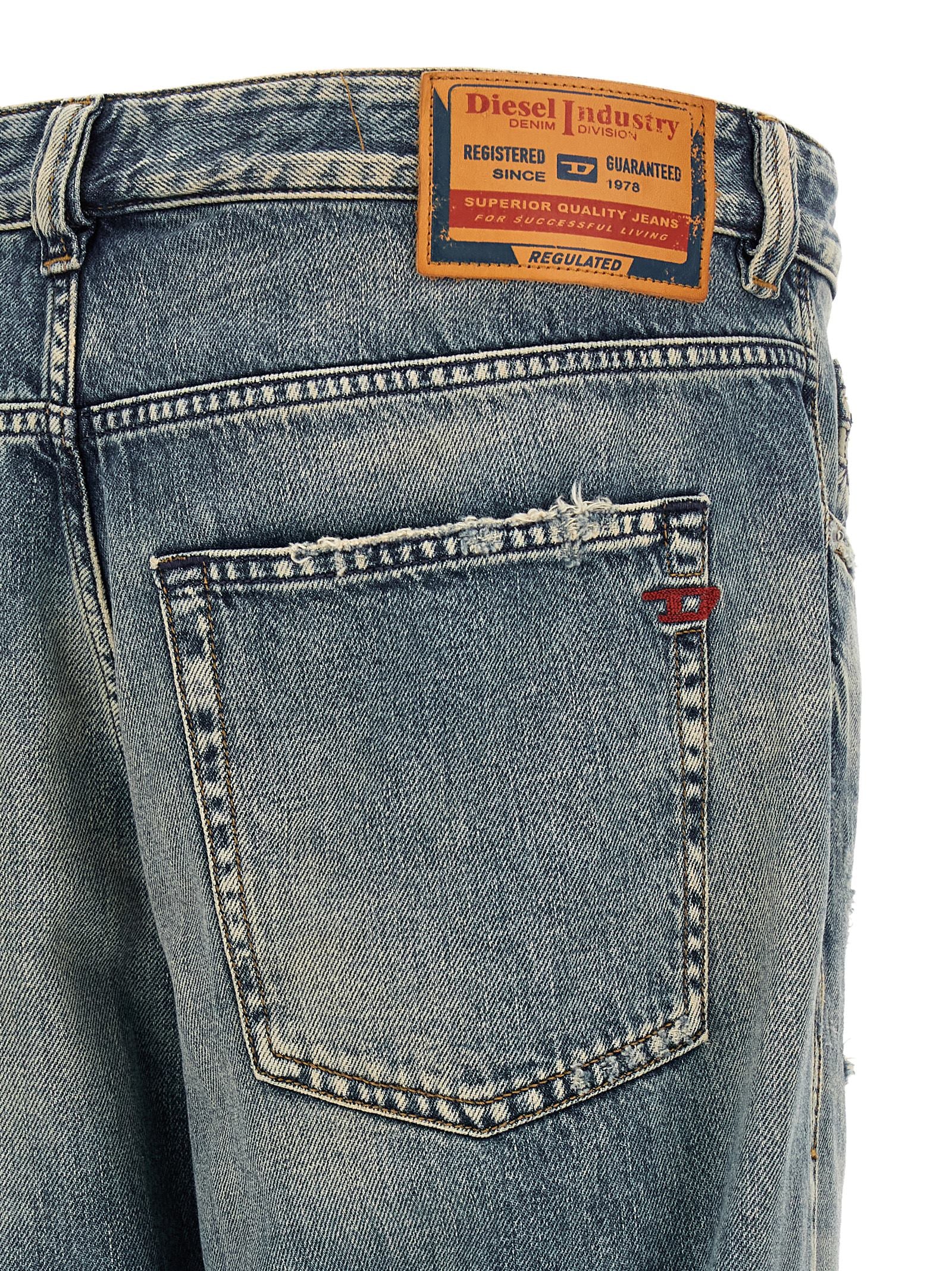 Jeans by Diesel for men in lyocell denim cotton blue & red presents a tailored silhouette, showcasing a tailored tapered-leg & regular-fit and long cut with a refined for a truly tailored aesthetic.