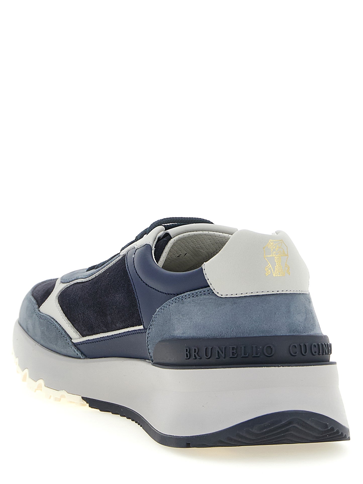 Athletic Sneakers by Brunello Cucinelli for men in suede calfskin leather light-blue, navy, white & signature showcases an impeccable silhouette, defined by an impeccable athletic style design that perfectly captures the essence of the Men's Athletic Suede Calfskin Leather Sneakers.