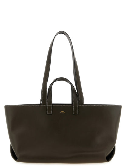 Tote Clutch Bag by A.P.C. for women in leather & cotton brown & gold features an jet-setting Le Drummer Leather & Cotton Tote Clutch Bag design with a secure , jet-setting , and versatile handle for a jet-setting look.