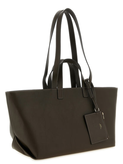 Tote Clutch Bag by A.P.C. for women in leather & cotton brown & gold features an jet-set Le Drummer Leather & Cotton Tote Clutch Bag design with a secure , ample , and versatile handle for an jet-set finish.