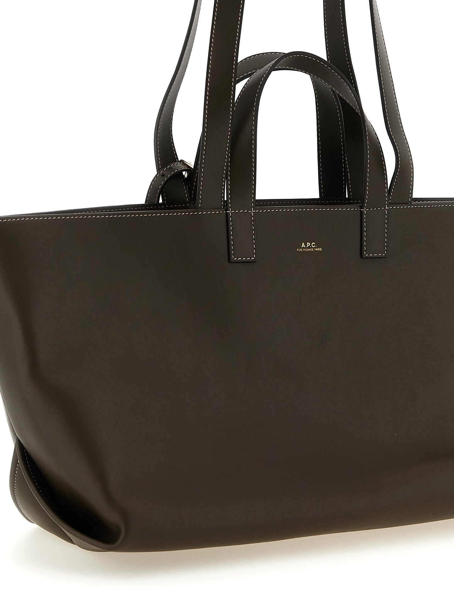 Tote Clutch Bag by A.P.C. for women in leather & cotton brown & gold showcases a statuesque Le Drummer Leather & Cotton Tote Clutch Bag design, featuring a secure , ample , and versatile handle for a statuesque finish.