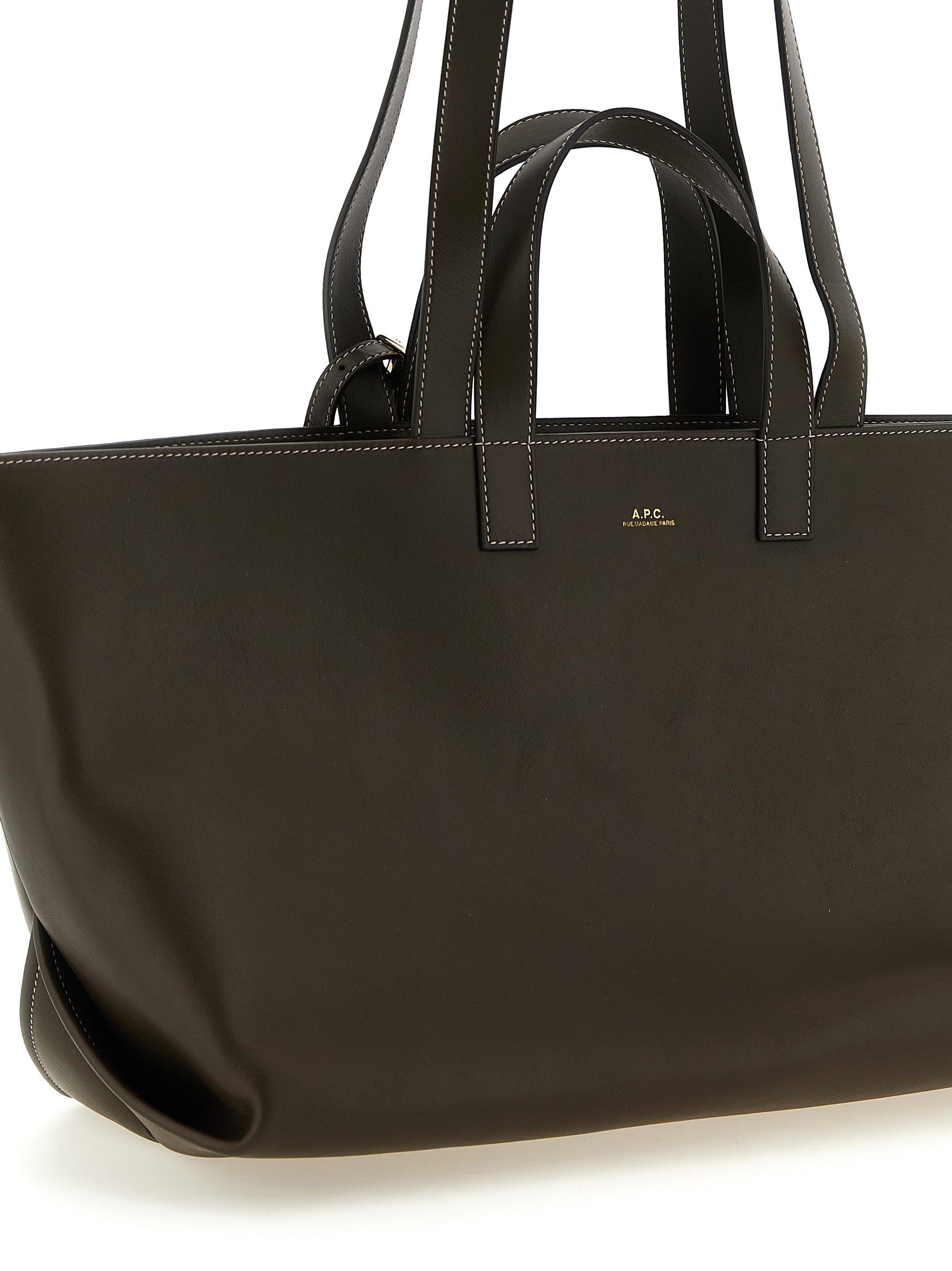 Tote Clutch Bag by A.P.C. for women in leather & cotton brown & gold showcases a statuesque Le Drummer Leather & Cotton Tote Clutch Bag design, featuring a secure , ample , and versatile handle for a statuesque finish.