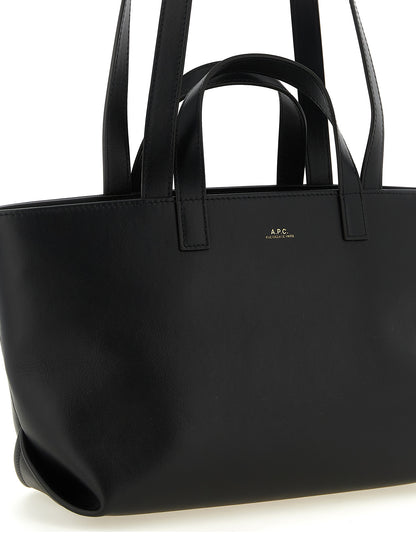 Small Shopper Tote Clutch Bag by A.P.C. for women in cotton polyester canvas black & gold features an jet-set-ready silhouette, showcasing the Le Drummer Cotton Polyester Canvas Small Shopper Tote Clutch Bag design with a secure zipper, ample , and versatile handle.