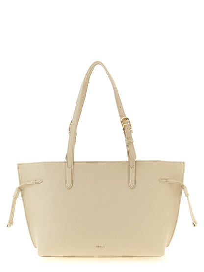 This Pouch Tote Bag by Furla for women in calfskin leather burgundy, cream, gold & white features an jet-set 1927 Ava Calfskin Leather Pouch Tote Bag design with a secure zipper & buckle, ample , and jet-set handle & adjustable-strap.