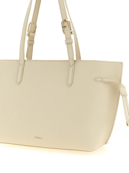 Pouch Tote Bag by Furla for women in calfskin leather burgundy, cream, gold & white features a jet-set sophisticated 1927 Ava Calfskin Leather Pouch Tote Bag design with a secure zipper & buckle, ample , and versatile handle & adjustable-strap for a jet-set sophisticated finish.
