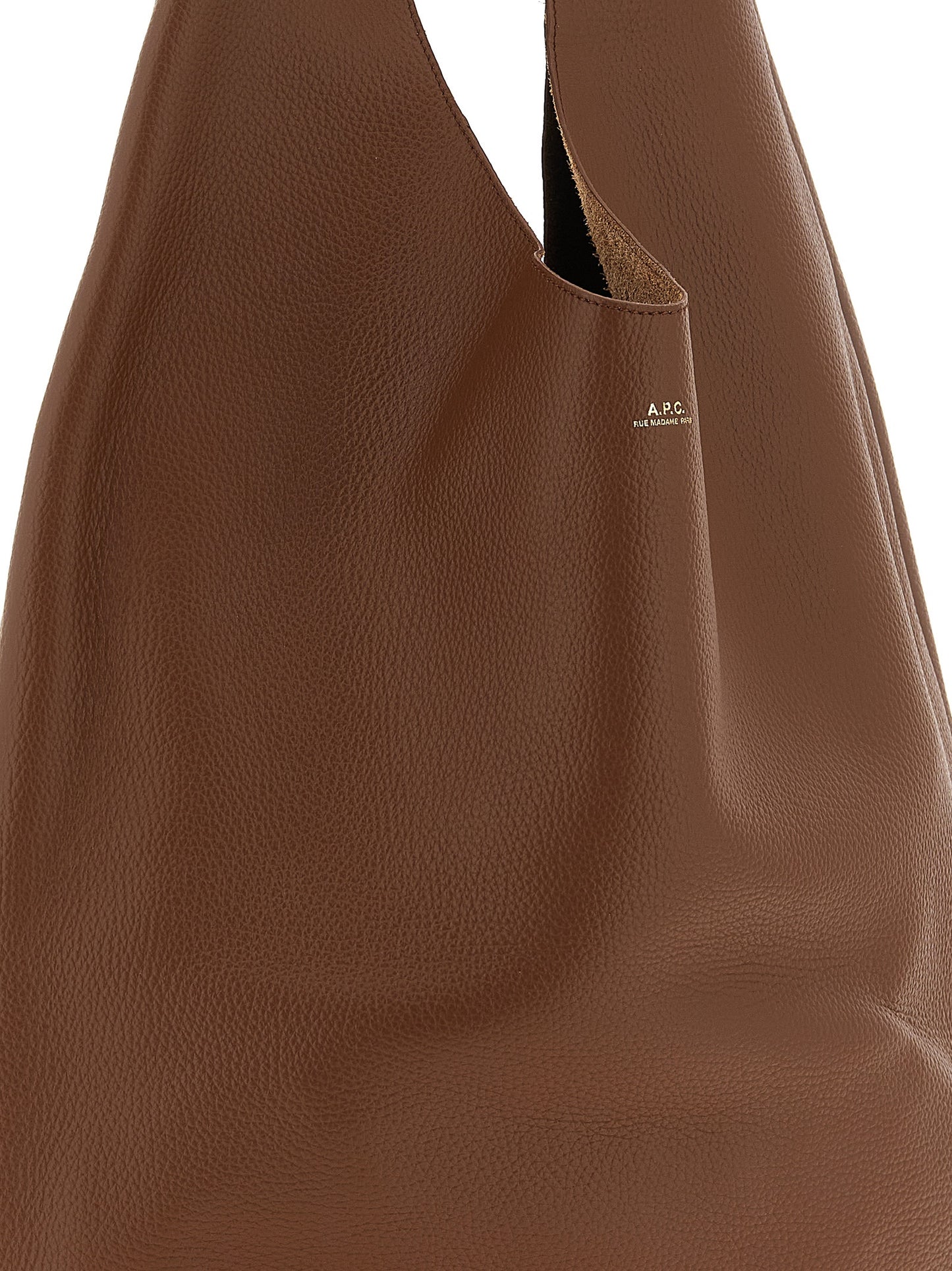Shoulder Hobo Bag by A.P.C. for women in suede leather brown, gold & hazelnut showcases a statuesque silhouette, artfully detailed with a secure , organized , and versatile shoulder-strap & handle for a statuesque look.
