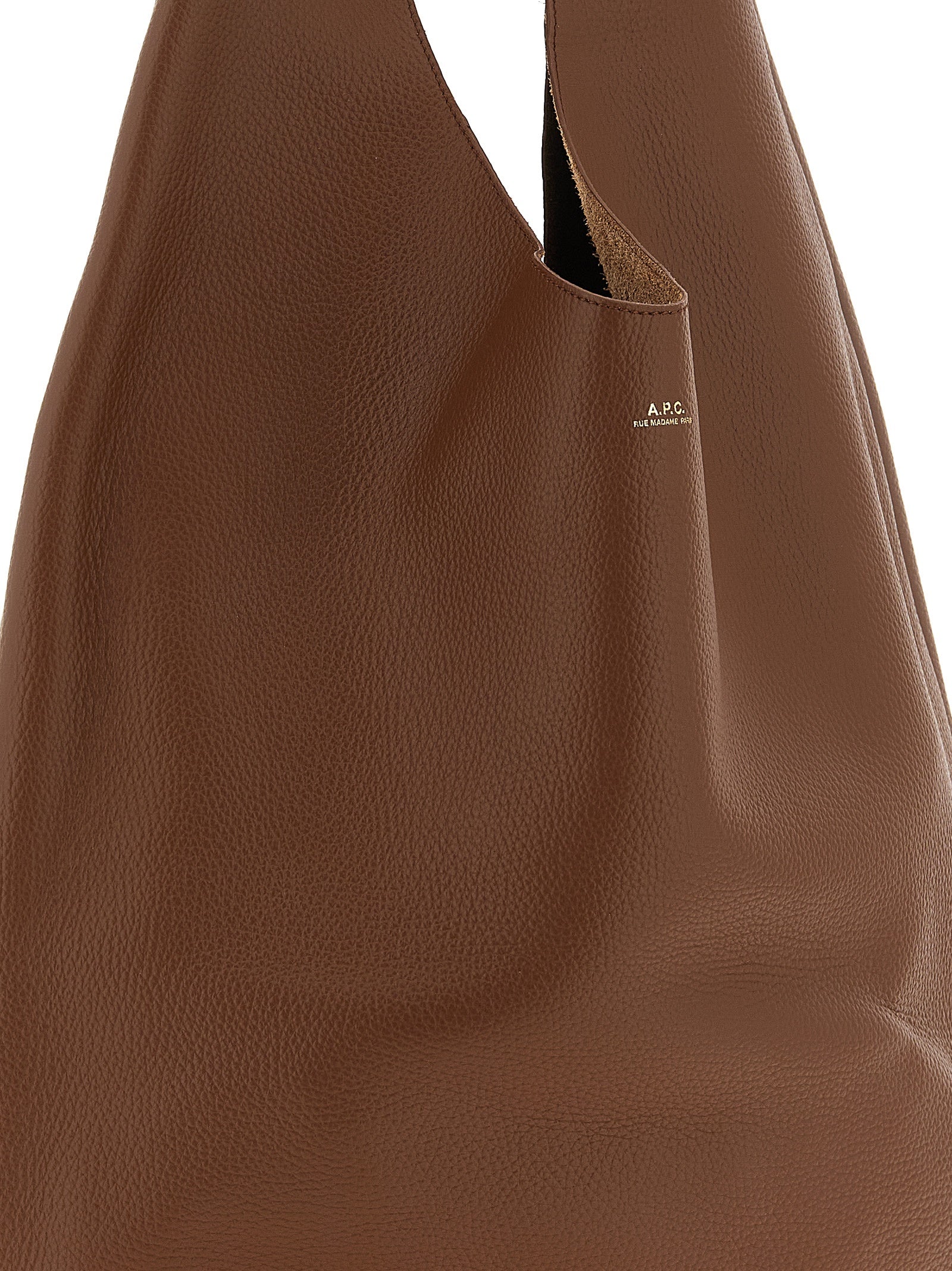 Shoulder Hobo Bag by A.P.C. for women in suede leather brown, gold & hazelnut showcases a statuesque silhouette, artfully detailed with a secure , organized , and versatile shoulder-strap & handle for a statuesque look.