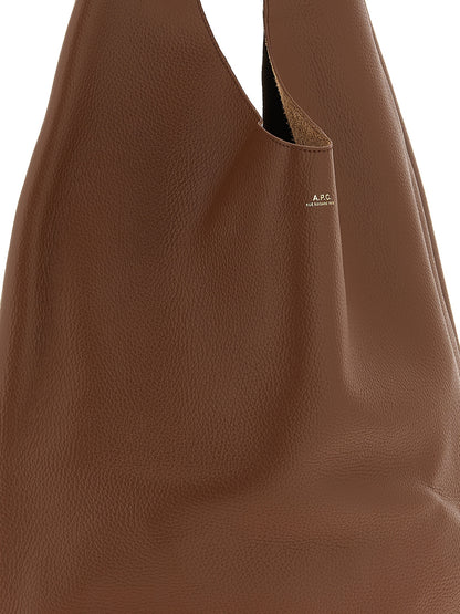 Shoulder Hobo Bag by A.P.C. for women in suede leather brown, gold & hazelnut showcases a statuesque silhouette, artfully detailed with a secure , organized , and versatile shoulder-strap & handle for a statuesque look.