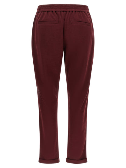 Joggers by Brunello Cucinelli for women in cotton & silk bordeaux presents a refined pantology silhouette, artfully defined by a refined pantology , long, and a sophisticated .