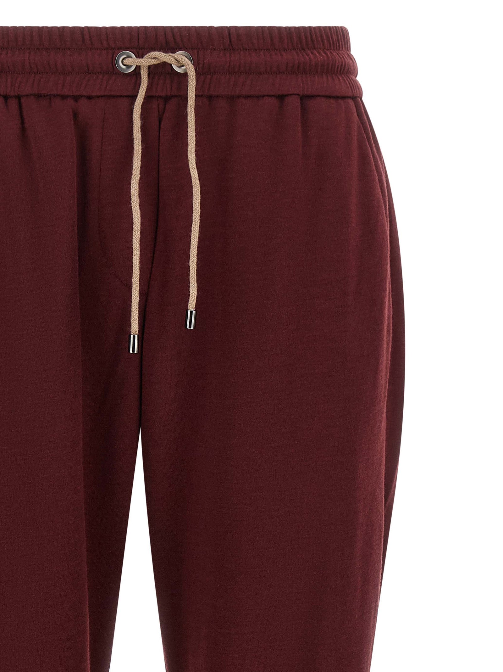 Joggers by Brunello Cucinelli for women in cotton & silk bordeaux features a polished silhouette with a polished , reaching a polished long and finished with a polished .
