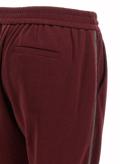 Joggers by Brunello Cucinelli for women in cotton & silk bordeaux features an sophisticated and with a precise long, creating a sophisticated and sophisticated silhouette.
