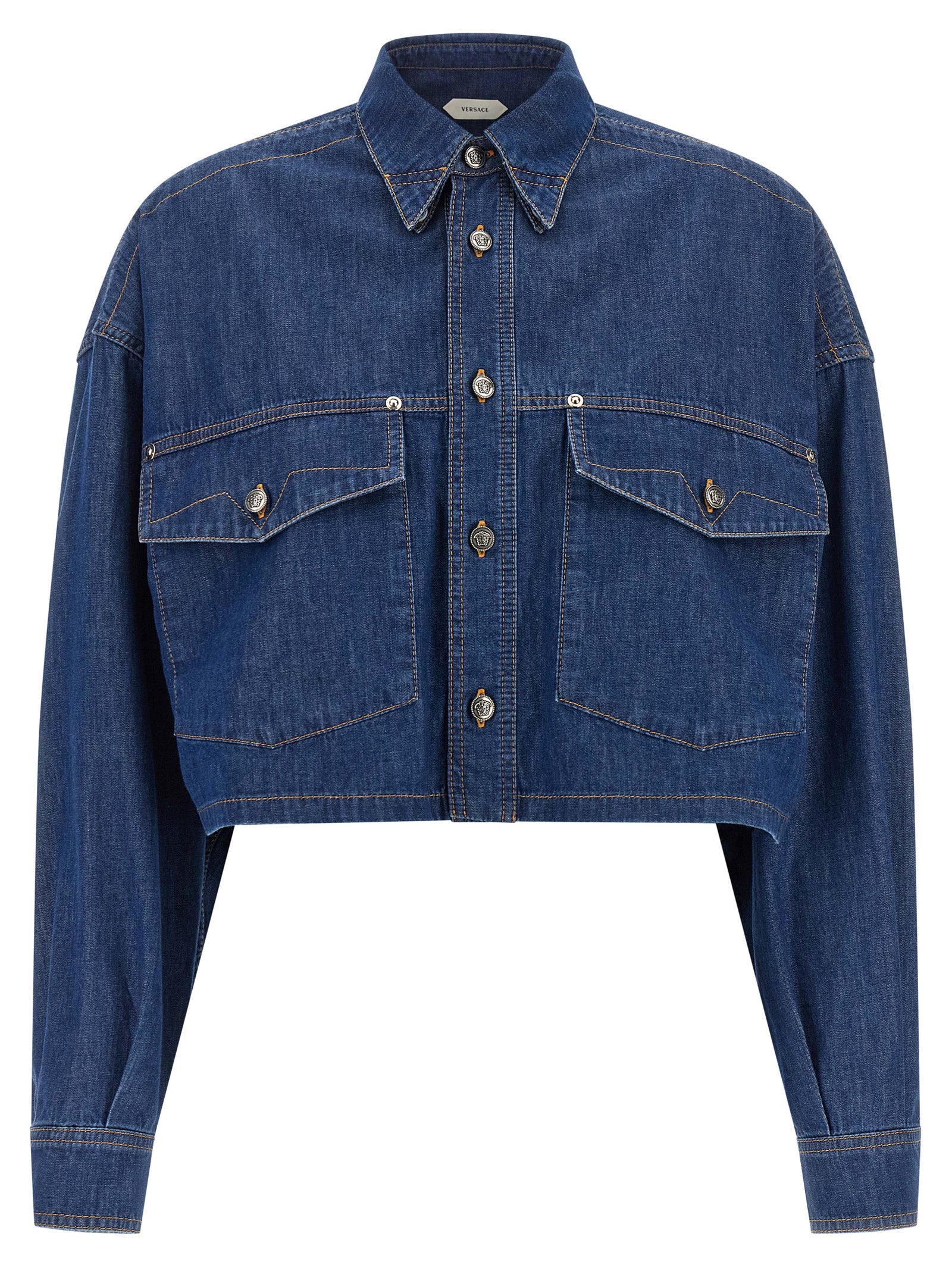 Blouse by Versace for women in denim cotton blue & silver showcases a sleek silhouette, elegantly detailed with a sleek square neckline and for a sleek finish.