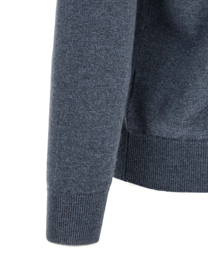 Cardigan by Brunello Cucinelli for men in cashmere blue showcases a luxurious silhouette, meticulously detailed with a sophisticated high-neck neckline and for a refined finish.