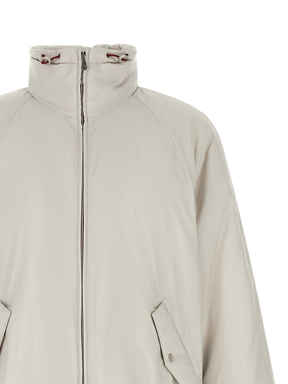 Hooded Windbreaker Jacket by Brunello Cucinelli for men in polyester & nylon white features an enduring silhouette, showcasing technical lightweight, pockets, hooded & windproof and a sophisticated hooded neckline for a truly enduring aesthetic.