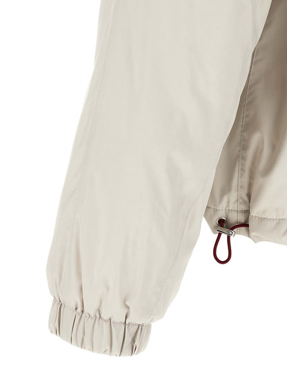 Hooded Windbreaker Jacket by Brunello Cucinelli for men in polyester & nylon white showcases a urban chic silhouette, detailed with a urban chic and functional lightweight, pockets, hooded & windproof for a polished finish.