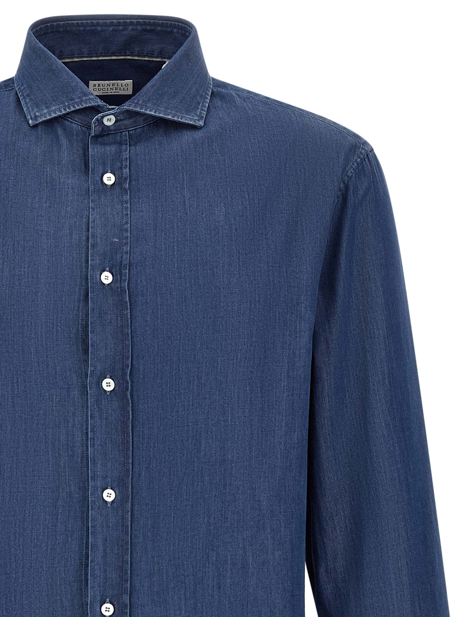 Shirt by Brunello Cucinelli for men in denim cotton blue, indigo & pearl showcases a sleek silhouette, elegantly detailed with a sleek and for a sleek finish.