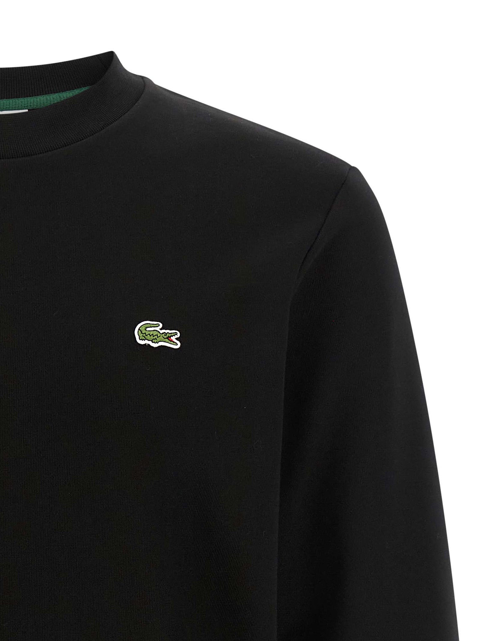 Sweatshirt by Lacoste for men in cotton black & green showcases a slouchy chic silhouette, artfully detailed with a slouchy chic crew neckline and for a slouchy chic finish.