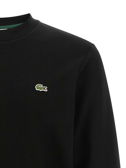Sweatshirt by Lacoste for men in cotton black & green showcases a slouchy chic silhouette, artfully detailed with a slouchy chic crew neckline and for a slouchy chic finish.