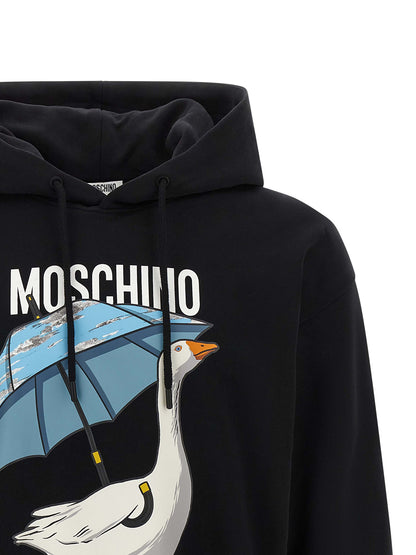 Sweatshirt Hoodie by Moschino for men in cotton black & print features an avant-garde silhouette, showcasing a sophisticated hooded neckline and detail for a truly avant-garde finish.