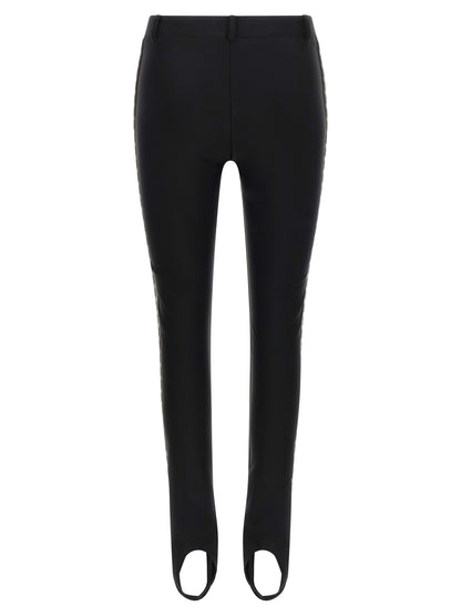 Activewear Leggings by Moschino for women in polyamide bicolour & black features an versatile silhouette, showcasing with a versatile leggings, long, and for a high-performance look.