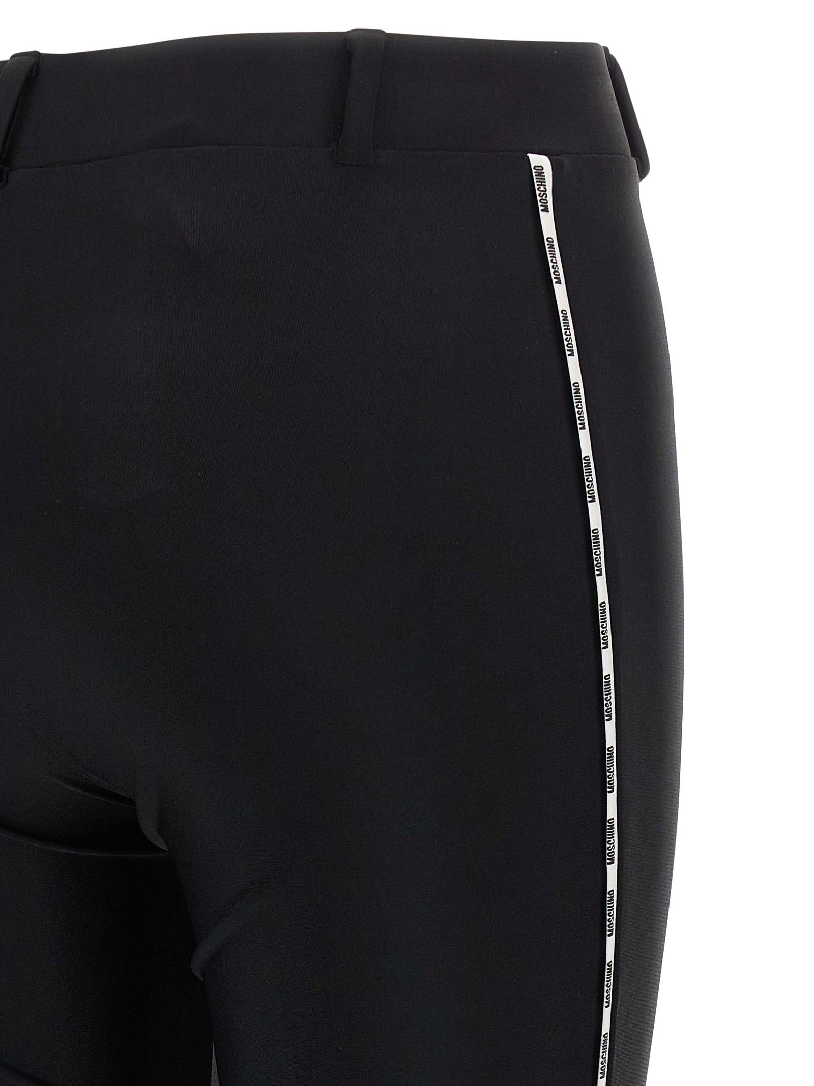 Activewear Leggings by Moschino for women in polyamide bicolour & black features an versatile silhouette, showcasing with a versatile leggings, long, and for a high-performance look.