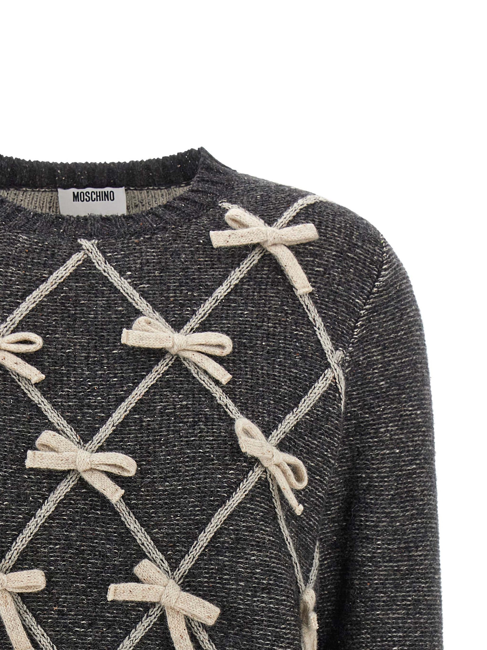 Cardigan by Moschino for women in wool & silk gray & patterned showcases a luxurious silhouette, meticulously detailed with a sophisticated crew neckline and for a refined finish.