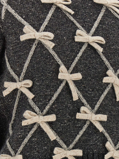 Cardigan by Moschino for women in wool & silk gray & patterned showcases a captivating silhouette, artfully detailed with a captivating and for a truly sophisticated captivating look.