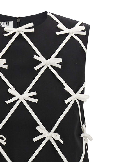Dress by Moschino for women in virgin wool bicolour & patterned features an eye catching silhouette with a sophisticated round neckline, elegant , and a refined short mini for a eye catching aesthetic.