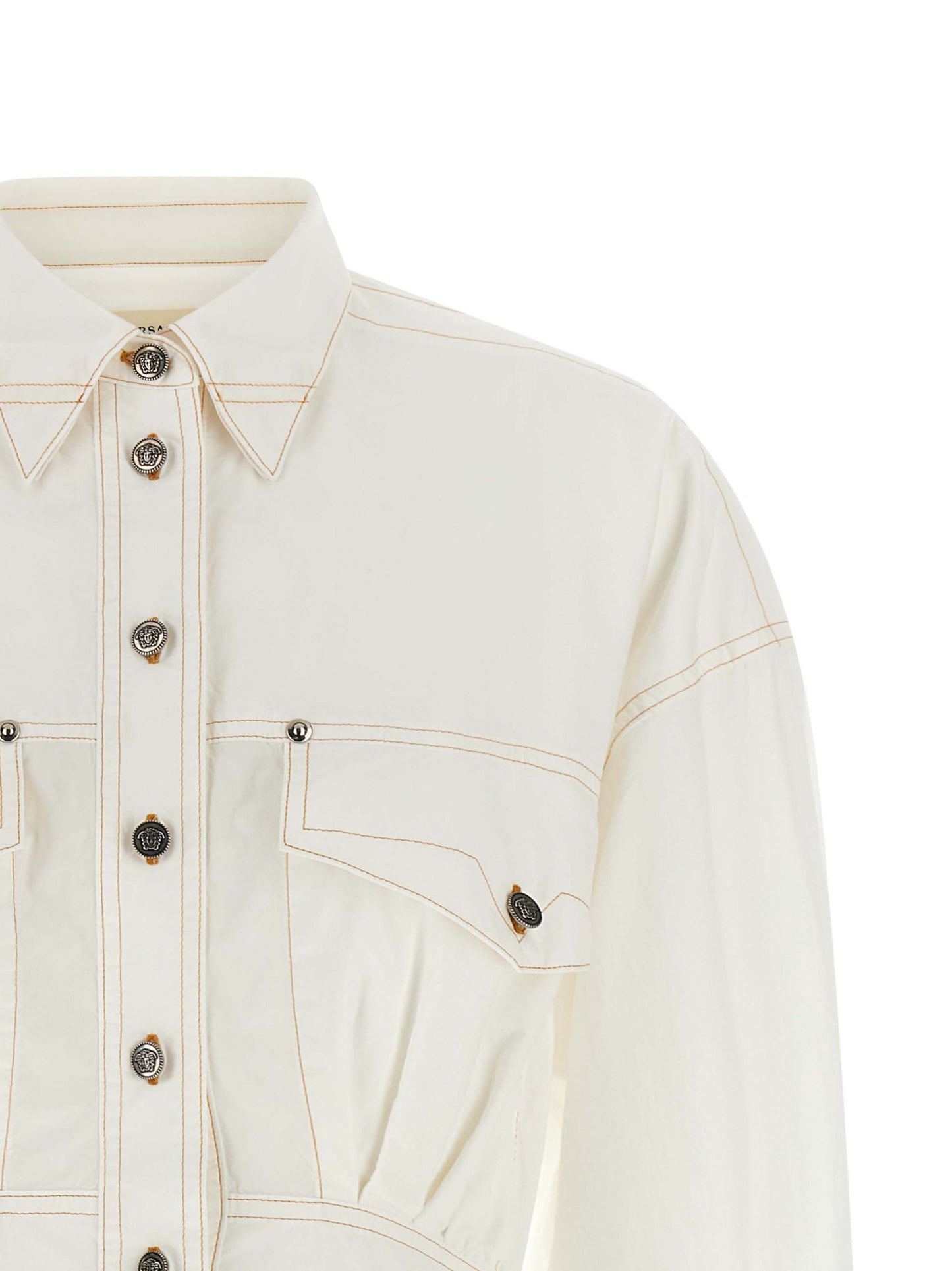 Dress by Versace for women in cotton white showcases a striking silhouette, elegantly detailed with a , refined , and a striking short for a striking finish.