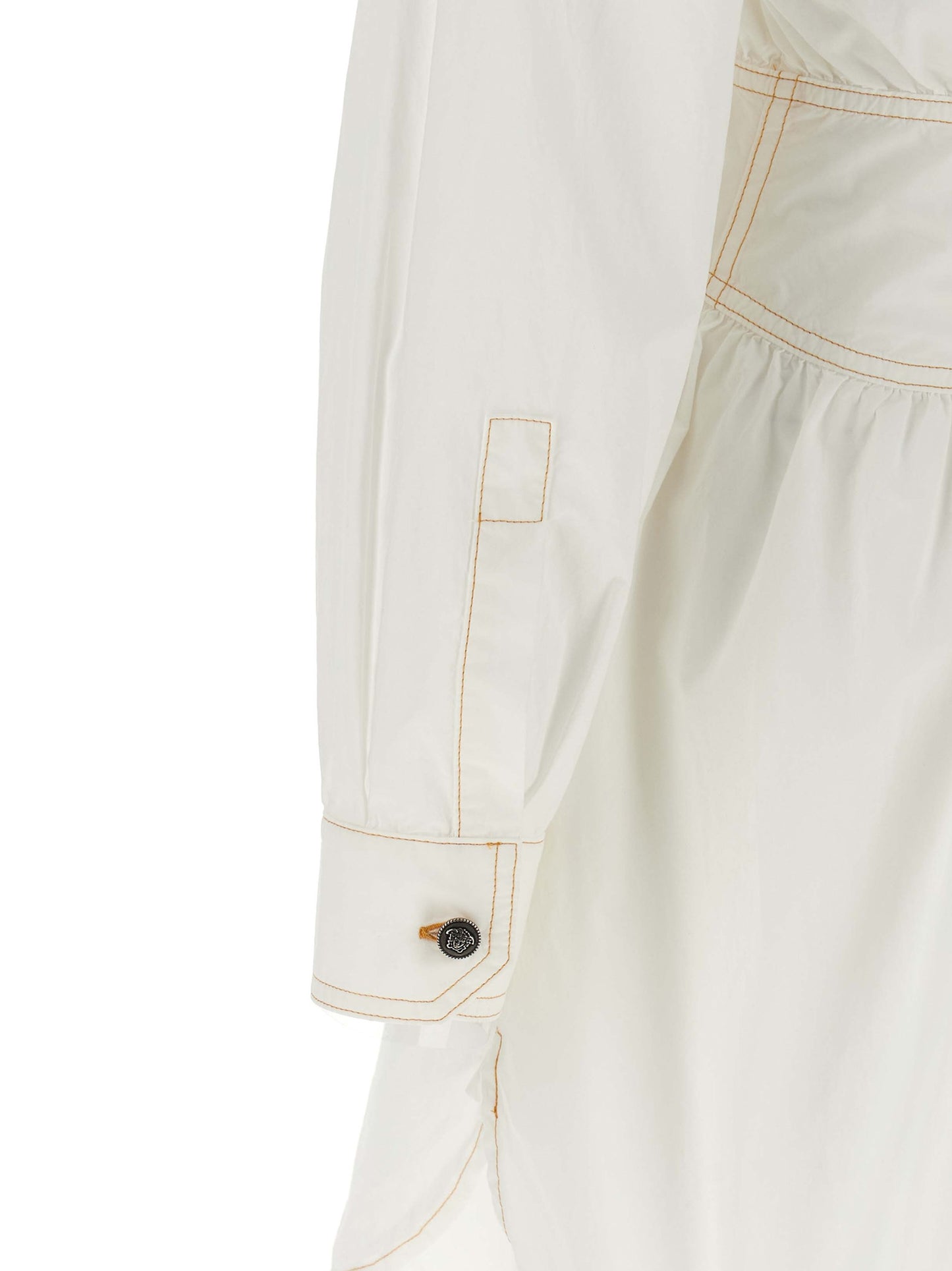 Dress by Versace for women in cotton white presents a sinuous silhouette, showcasing a sophisticated and detailed with a sinuous short for a refined finish.