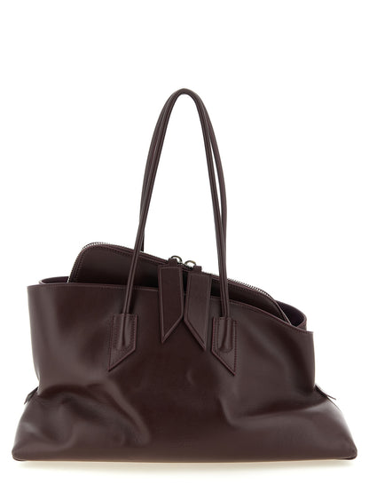 Medium Shoulder Bag by The Attico for women in calf leather plum, purple & silver showcases a statuesque silhouette, artfully detailed with a secure zipper, organized , and versatile shoulder-strap & handle for a statuesque look.