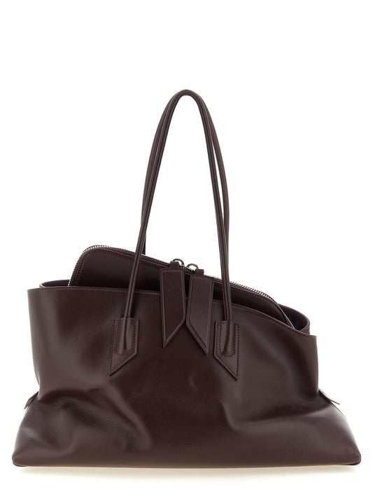 Medium Shoulder Bag by The Attico for women in calf leather plum, purple & silver showcases a statuesque silhouette, artfully detailed with a secure zipper, organized , and versatile shoulder-strap & handle for a statuesque look.