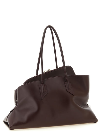 Medium Shoulder Bag by The Attico for women in calf leather plum, purple & silver features a effortless chic silhouette with a secure zipper, ample , and versatile shoulder-strap & handle for a effortless chic finish.