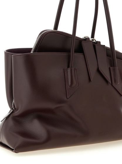 Medium Shoulder Bag by The Attico for women in calf leather plum, purple & silver features a statuesque silhouette, showcasing a secure zipper and statuesque with versatile shoulder-strap & handle for a statuesque finish.