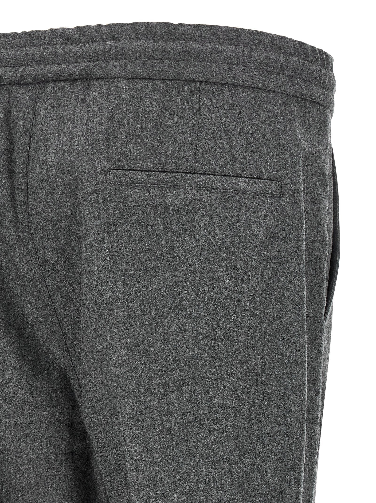 Trousers by Brunello Cucinelli for men in virgin wool & flannel gray features a sculptural silhouette, showcasing a sculptural relaxed-fit and long with a sophisticated for a sculptural finish.
