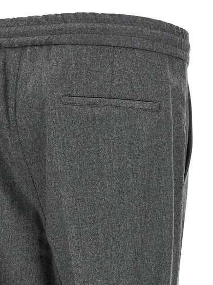 Trousers by Brunello Cucinelli for men in virgin wool & flannel gray features a sculptural silhouette, showcasing a sculptural relaxed-fit and long with a sophisticated for a sculptural finish.