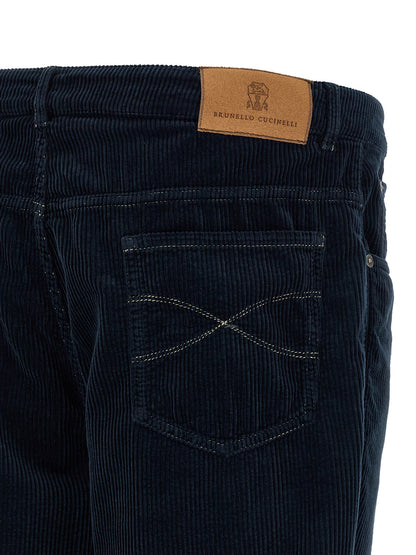 Trousers by Brunello Cucinelli for men in cotton velvet corduroy navy presents a perennial silhouette, meticulously tailored with a straight-leg cut, long finish, and an elegant .